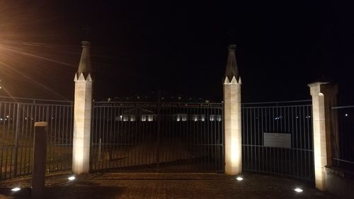 Illuminated building against sky at night