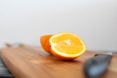 Close-up of orange slice on cutting board