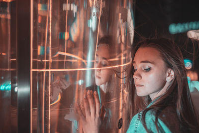 Woman by light painting at night