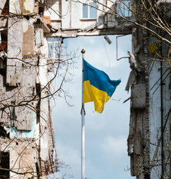 Low angle view of flag against sky