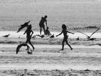 People playing on beach