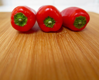 Close-up of red bell peppers on table