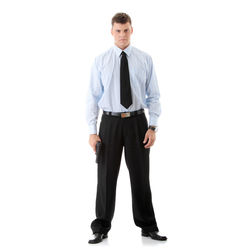 Portrait of young man standing against white background