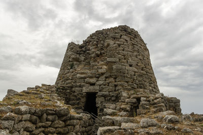 Low angle view of old ruins against sky