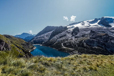 Scenic view of lake and mountains against sky