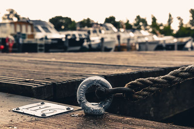 Close-up of rope tied on wood