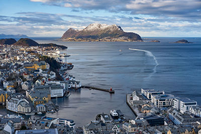 Godøy island in the back with Ålesund in the front, norway