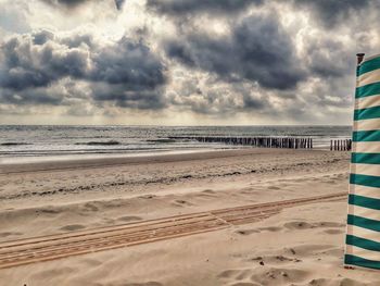 Scenic view of beach against sky