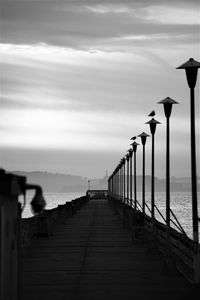 Pier over sea against sky