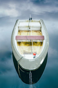 Close-up of a lonely boat tied to a pier