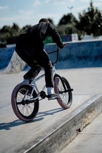 Man riding bicycle on street