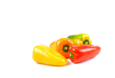 Close-up of bell peppers against white background