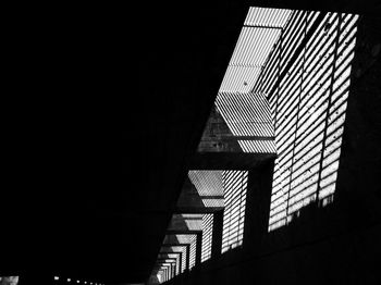 Low angle view of illuminated skyscraper against sky