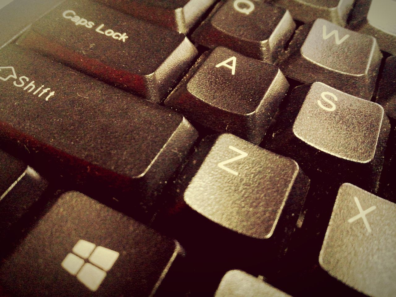 indoors, communication, text, close-up, computer keyboard, alphabet, western script, number, high angle view, technology, connection, full frame, wireless technology, still life, backgrounds, no people, capital letter, computer key, laptop, selective focus