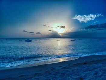 Scenic view of sea against blue sky