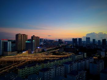 Cityscape against sky during sunset