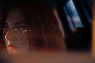 Close-up of young woman looking away