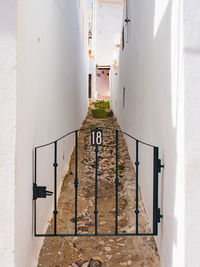 Narrow alley amidst buildings in city