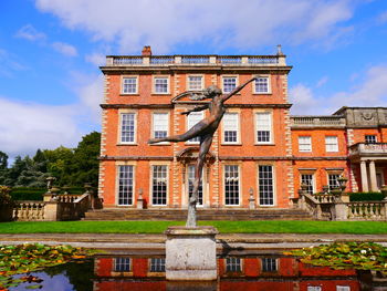 Statue in front of building