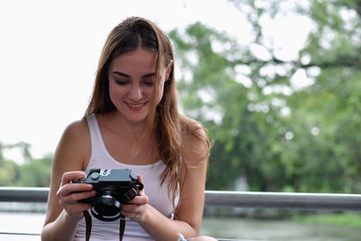 Close-up of woman photographing