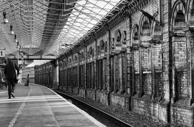 Man walking on railroad station platform