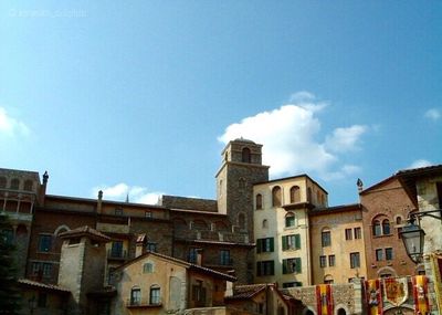 Low angle view of building against blue sky