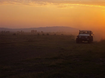 Scenic view of landscape at sunset