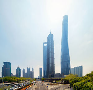 Modern buildings in city against clear sky