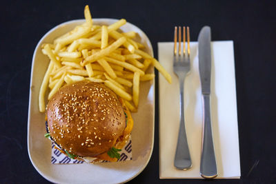 Close-up of burger and fries on table