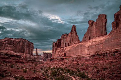 Rock formations on landscape against sky