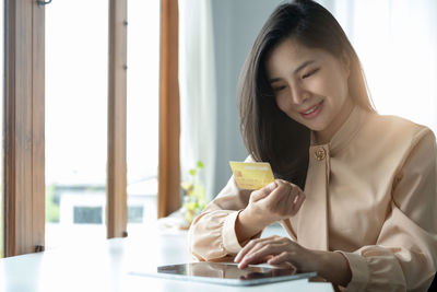 Young woman using mobile phone