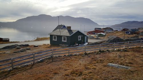 Houses in town against mountain range