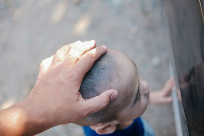 High angle view of man holding hands