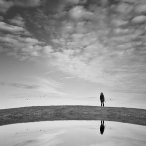 Man on beach against sky