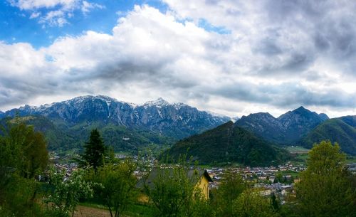 Scenic view of mountains against cloudy sky
