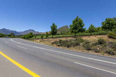 View of the road leading to franschhoekv - town in western cape with centuries-old vineyards.