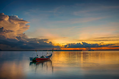 Scenic view of calm sea at sunset