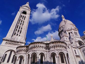 Low angle view of church against blue sky