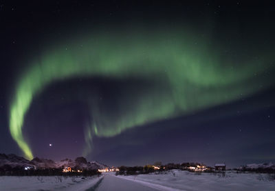 Scenic view of landscape against sky at night