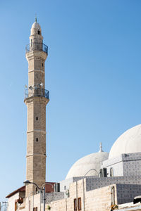 A beautiful mosque stand high over the town below