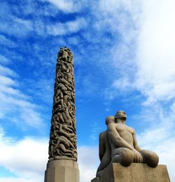 Low angle view of statue against sky