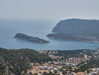 High angle view of sea and cityscape against sky