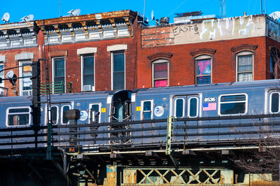 Train on railroad tracks in city