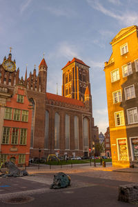 Buildings in city against sky