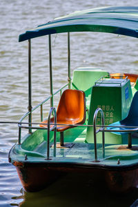 Close-up of boats moored in sea