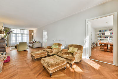 Chairs and tables on hardwood floor at home