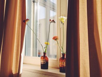 Flower vase on window sill