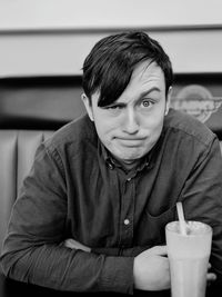 Portrait of man sitting at restaurant