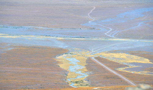 Aerial view of road passing through landscape