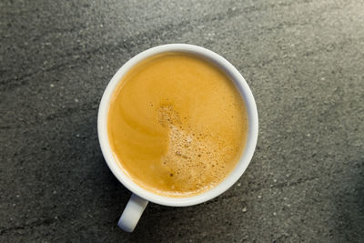 High angle view of coffee cup on table